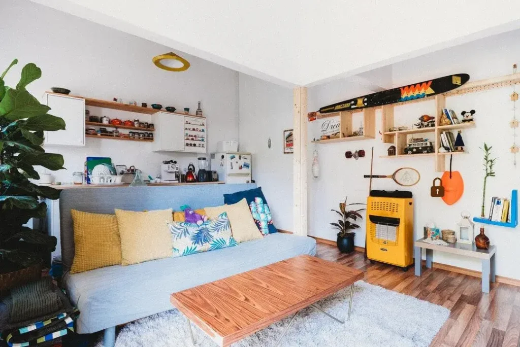 comfortable studio apartment with unique decorations on the wall